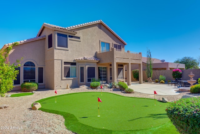 back of house with a patio area