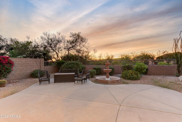 view of patio terrace at dusk