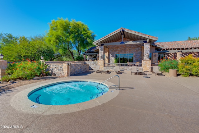 view of swimming pool featuring a patio area