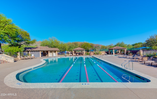 view of swimming pool featuring a gazebo and a patio