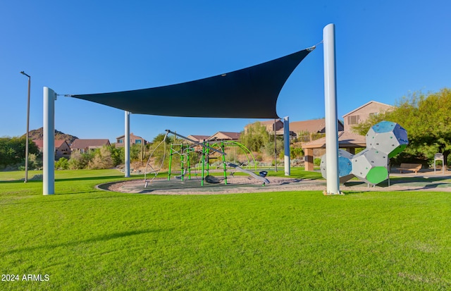 view of jungle gym with a lawn