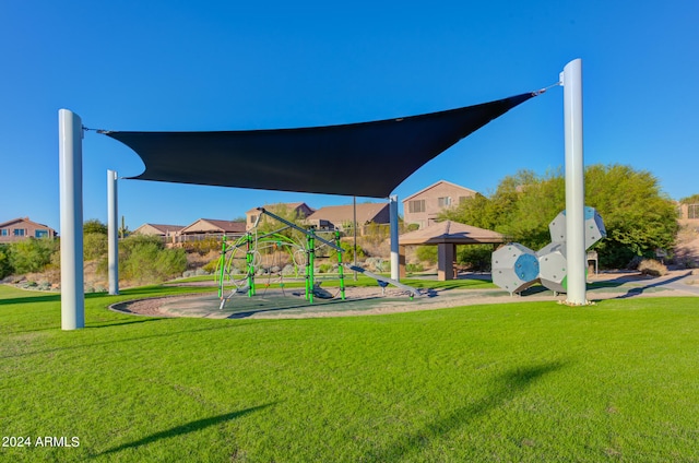 view of playground with a lawn