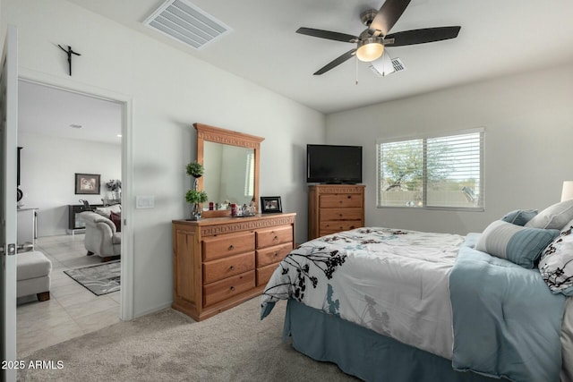 bedroom with light carpet and ceiling fan