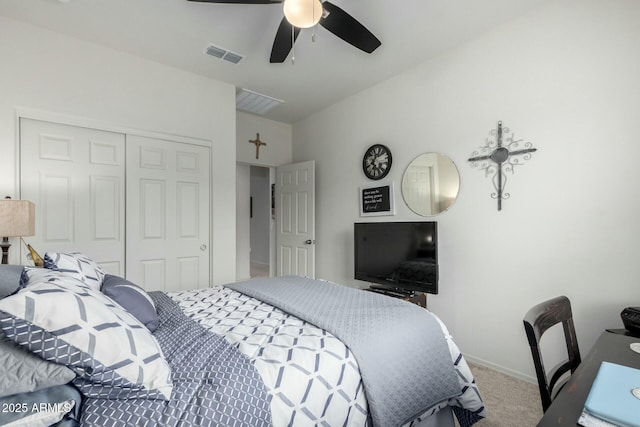 bedroom featuring vaulted ceiling, carpet floors, ceiling fan, and a closet