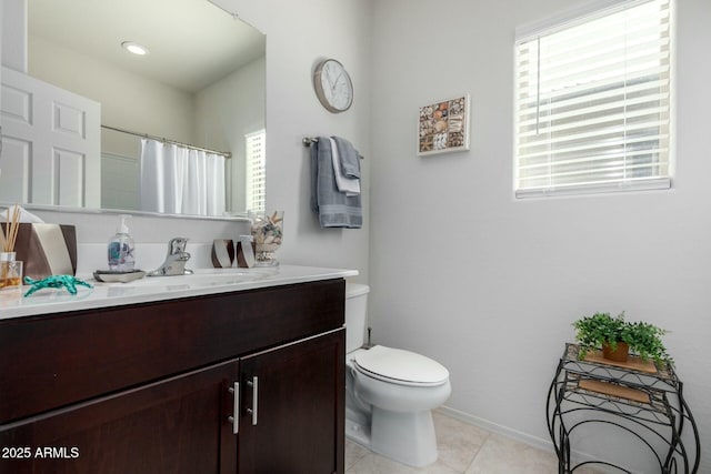 bathroom featuring vanity, curtained shower, tile patterned floors, and toilet