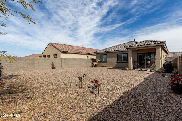 back of house with a patio area