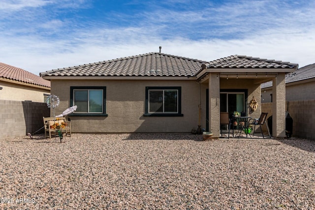 rear view of property with a patio area