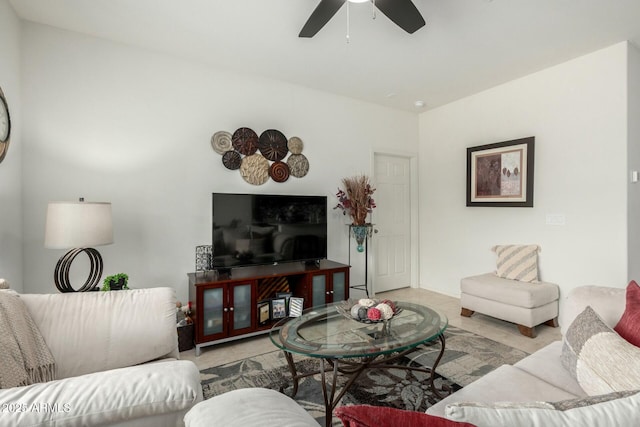 living room featuring ceiling fan and light tile patterned floors