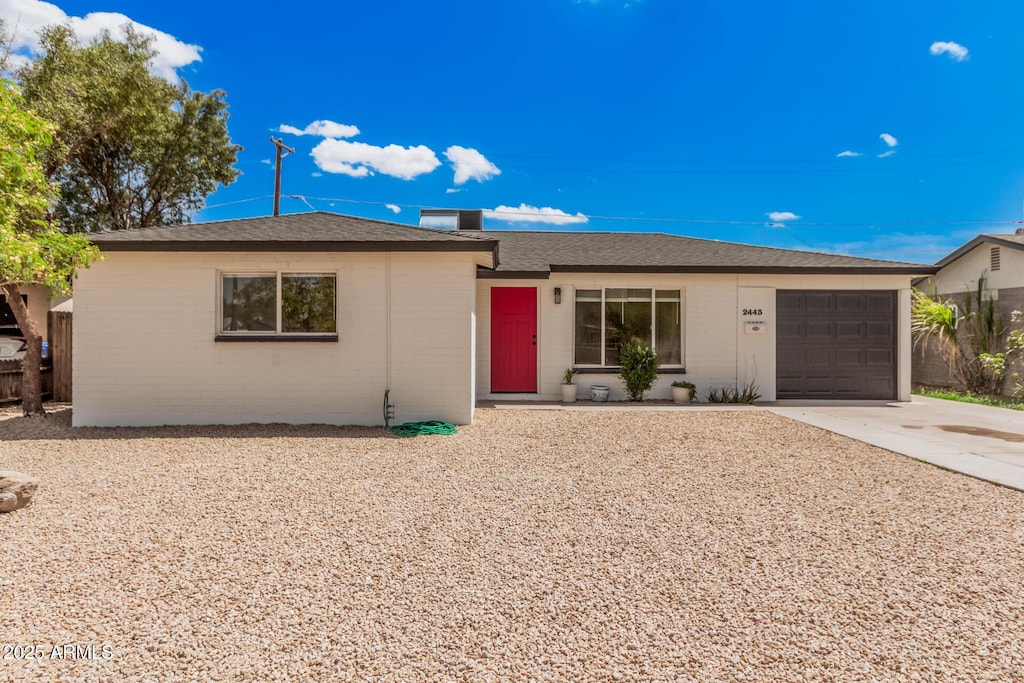 2443 N 37th Way, Phoenix, AZ 85008 - ranch-style home with an attached garage and concrete driveway