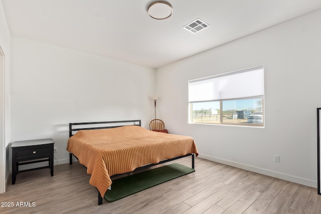 bedroom with light wood-type flooring