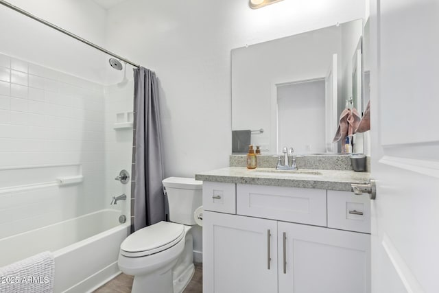 full bathroom with shower / bathtub combination with curtain, vanity, and toilet