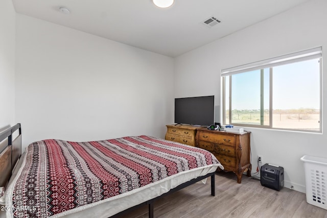 bedroom with light hardwood / wood-style floors