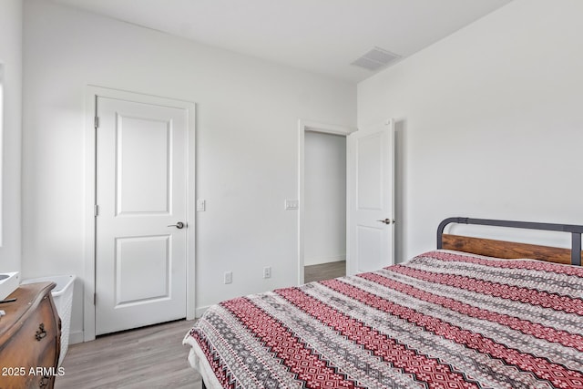 bedroom with light hardwood / wood-style flooring