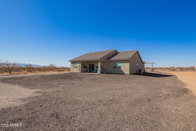 back of house featuring a rural view