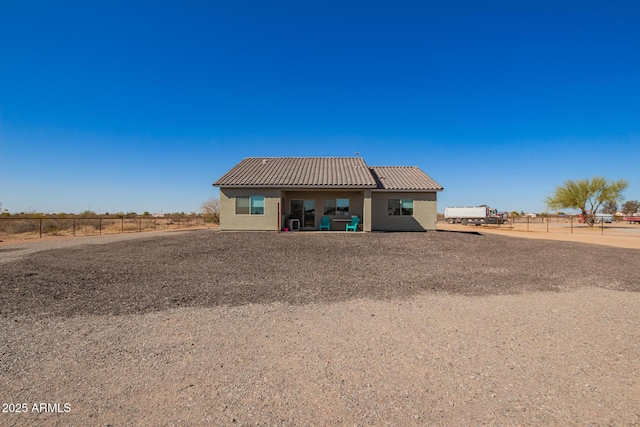 back of house featuring a rural view