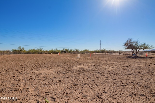 view of yard with a rural view