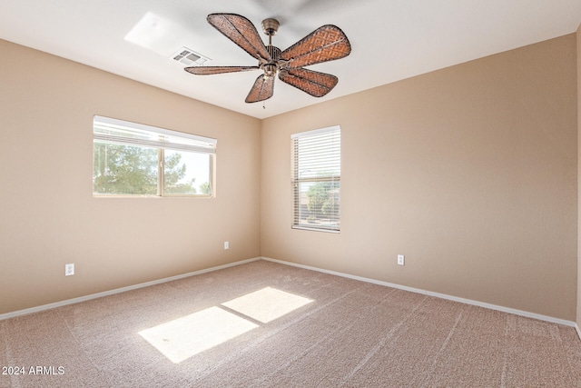 unfurnished room with carpet and ceiling fan