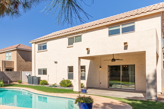 back of property featuring ceiling fan and a patio