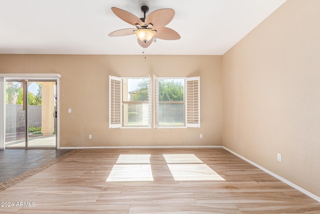 unfurnished room featuring ceiling fan