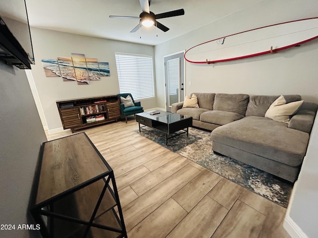 living room with hardwood / wood-style floors and ceiling fan