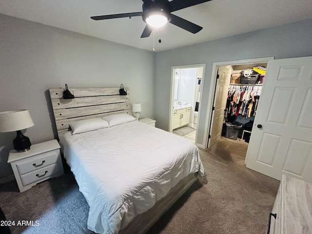 carpeted bedroom with connected bathroom, a spacious closet, a closet, and ceiling fan