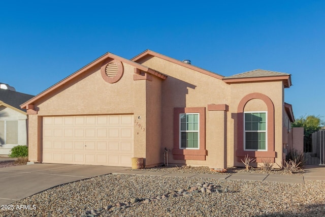 view of front of property with a garage