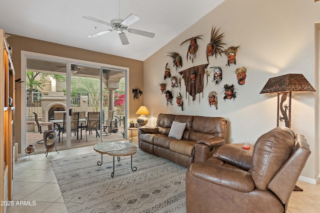 living room with vaulted ceiling, light tile patterned flooring, and ceiling fan