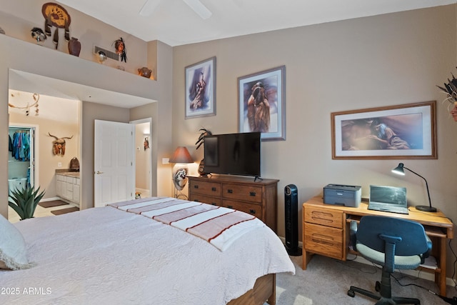 bedroom featuring ensuite bath, ceiling fan, and light colored carpet