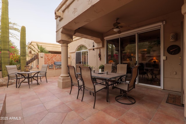 view of patio / terrace with a ceiling fan and outdoor dining space