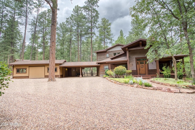 view of front facade featuring driveway and an attached carport