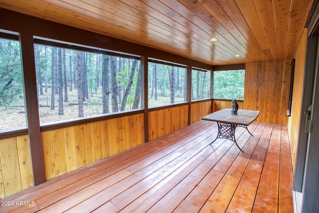 unfurnished sunroom featuring wooden ceiling