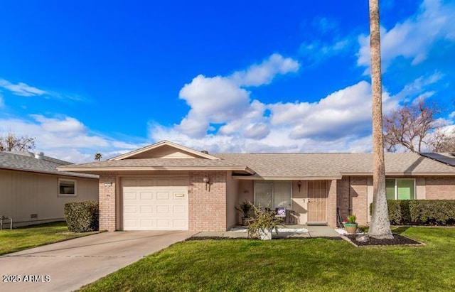 ranch-style home with a garage and a front yard