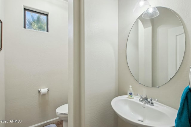 bathroom with sink and toilet