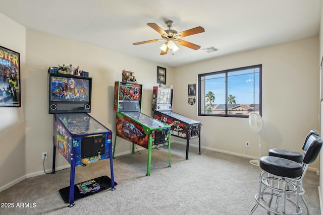 rec room with carpet flooring and ceiling fan