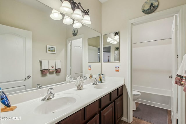 bathroom with vanity, toilet, and tile patterned flooring