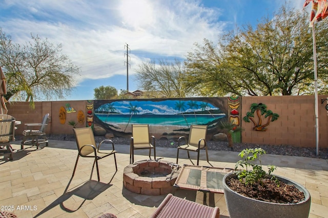 view of patio featuring a grill and a fire pit