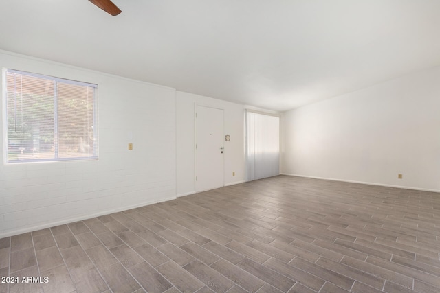 spare room featuring ceiling fan and hardwood / wood-style flooring