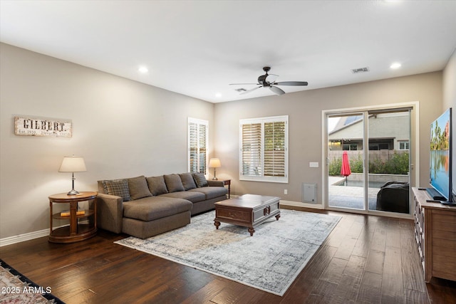 living area featuring recessed lighting, baseboards, ceiling fan, and dark wood-style flooring