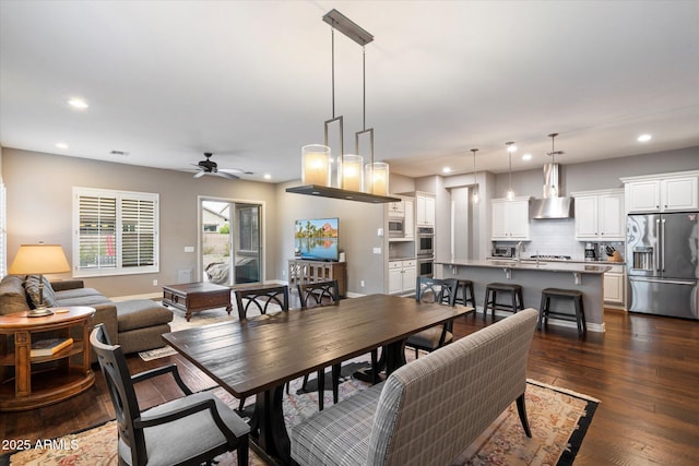 dining area with a ceiling fan, dark wood-type flooring, and recessed lighting