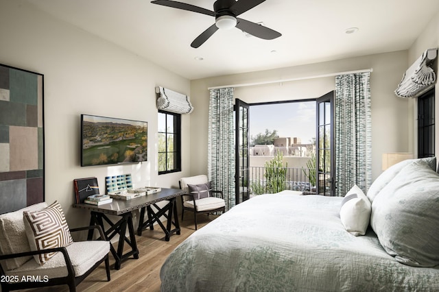 bedroom featuring hardwood / wood-style flooring, ceiling fan, and access to exterior