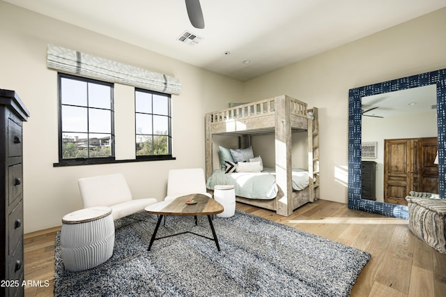 bedroom with hardwood / wood-style flooring and ceiling fan