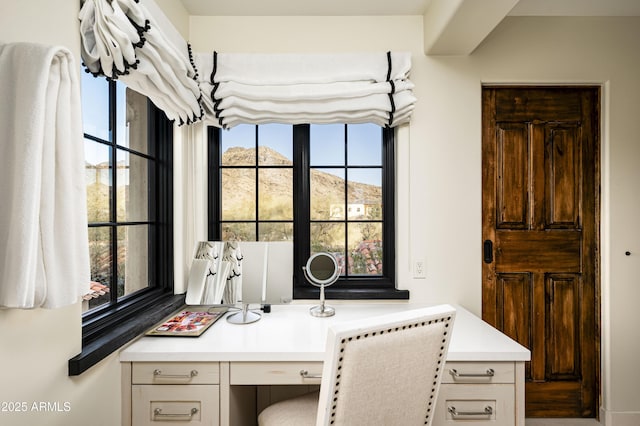 home office with a mountain view and built in desk