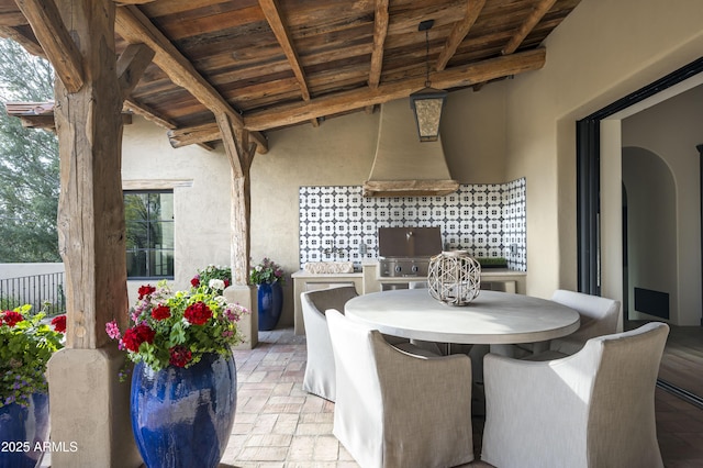 view of patio featuring area for grilling and exterior kitchen