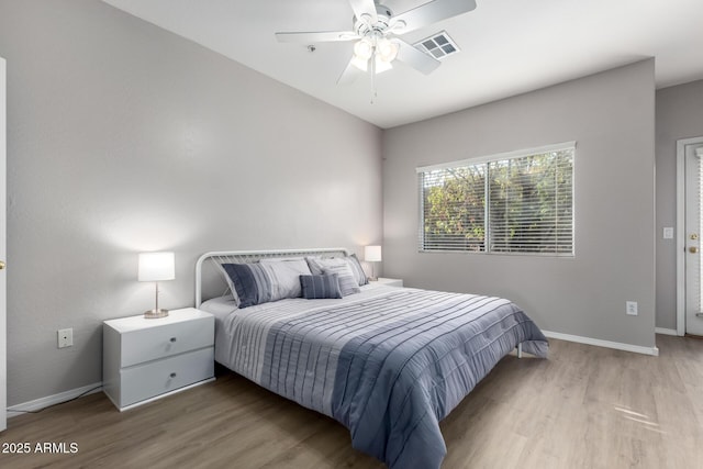 bedroom with ceiling fan and light wood-type flooring