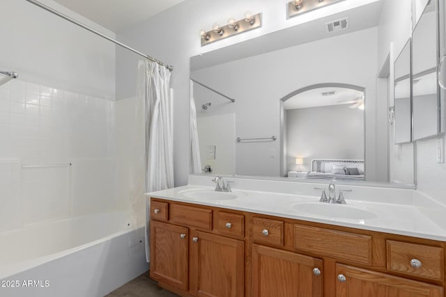 bathroom featuring vanity and shower / bath combo