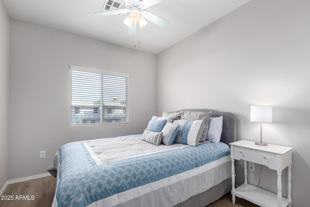 bedroom with ceiling fan and hardwood / wood-style floors