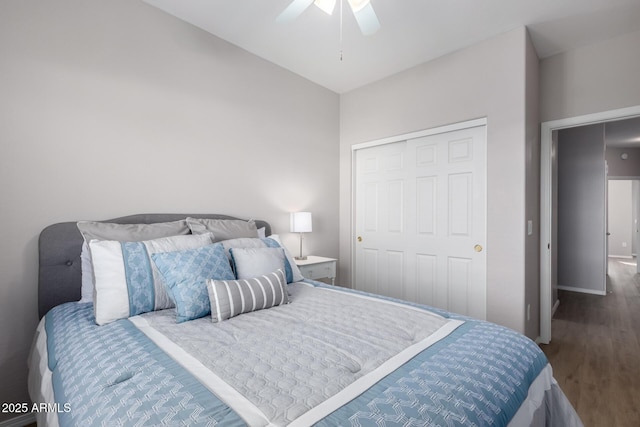 bedroom featuring hardwood / wood-style floors, ceiling fan, and a closet