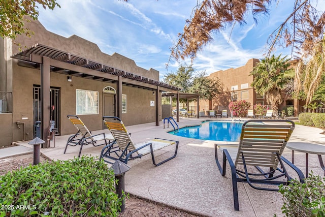 view of swimming pool with a pergola and a patio area