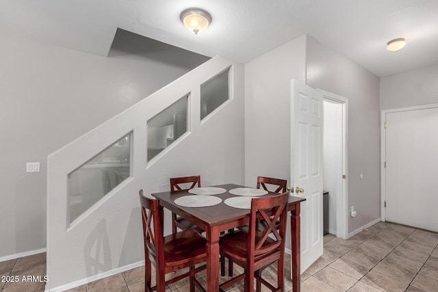 dining space with light tile patterned floors