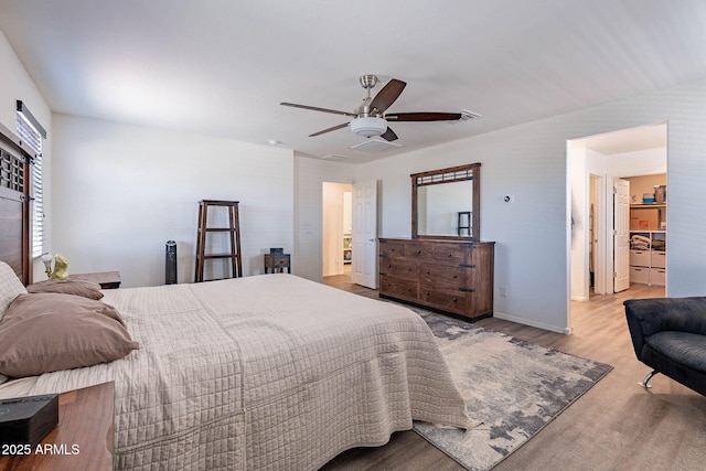 bedroom featuring wood finished floors and ceiling fan